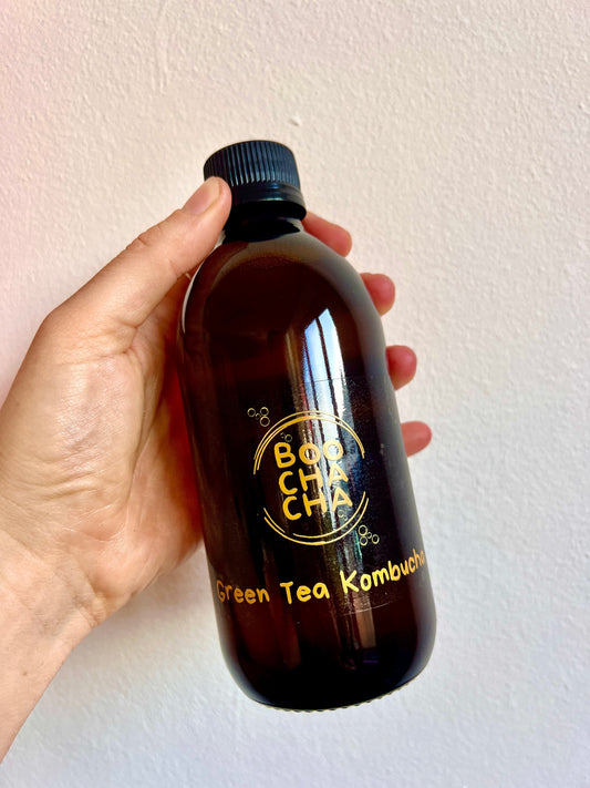 bottle of delicious, fresh, raw and high quality natural kombucha with boochacha branding looking vibrant and bright
