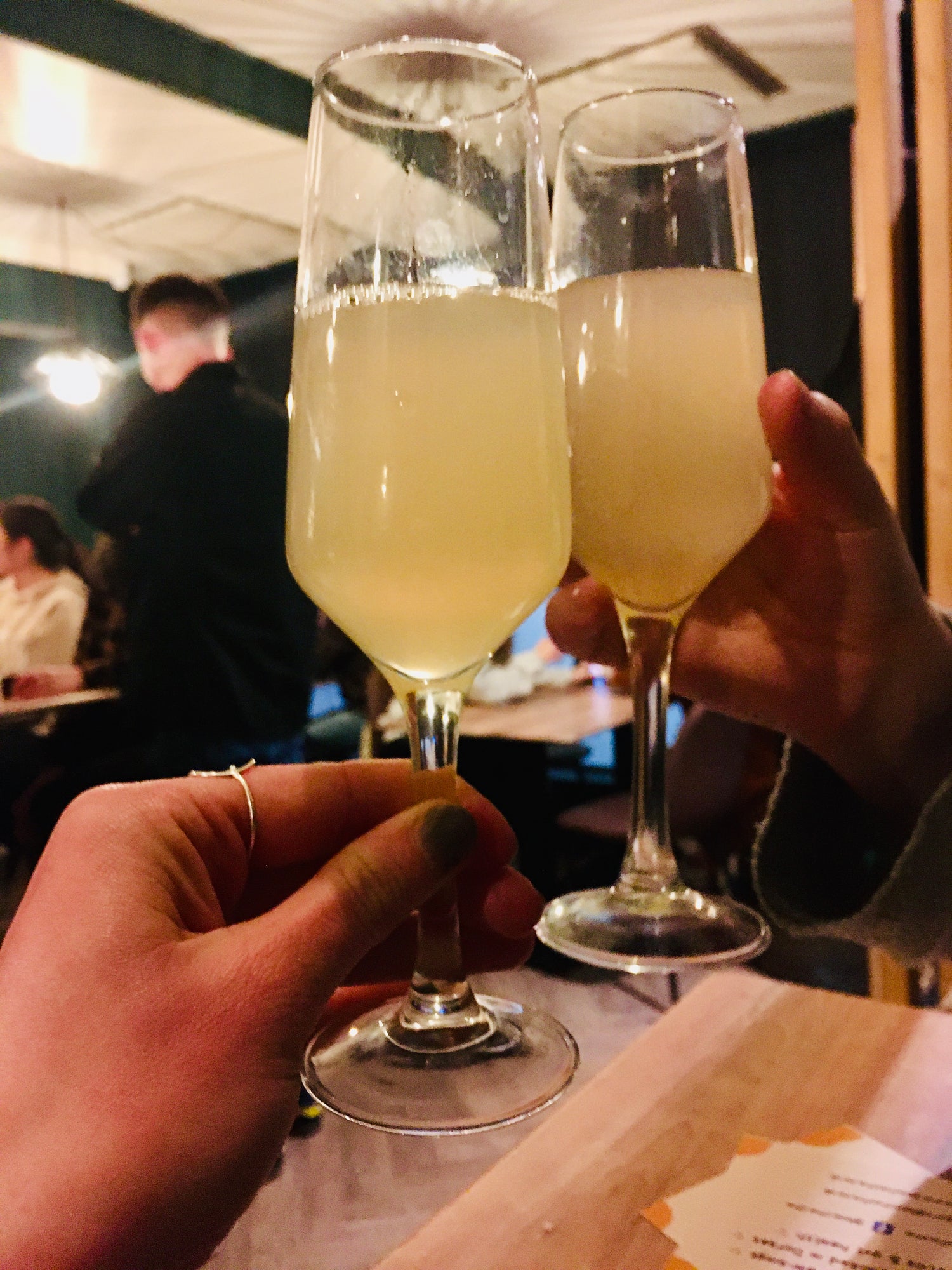 Kombucha in champagne glasses for a cheers with a good friend in a local alcohol free bar in bournemouth - BooChaCha