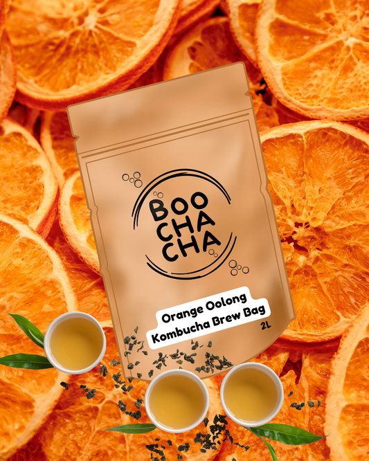 BOO CHA CHA orange oolong tea Kombucha Brew Bag on a background of orange slices
