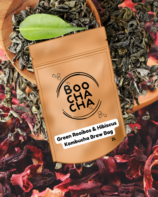 BoochaCha Green Rooibos & Hibiscus tea Kombucha Brew Bag on a bed of tea leaves